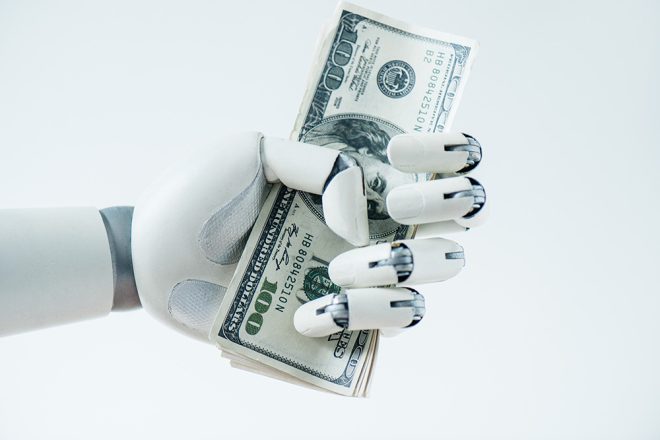 robot holding money