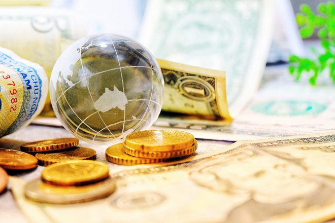 world currency and glass globe